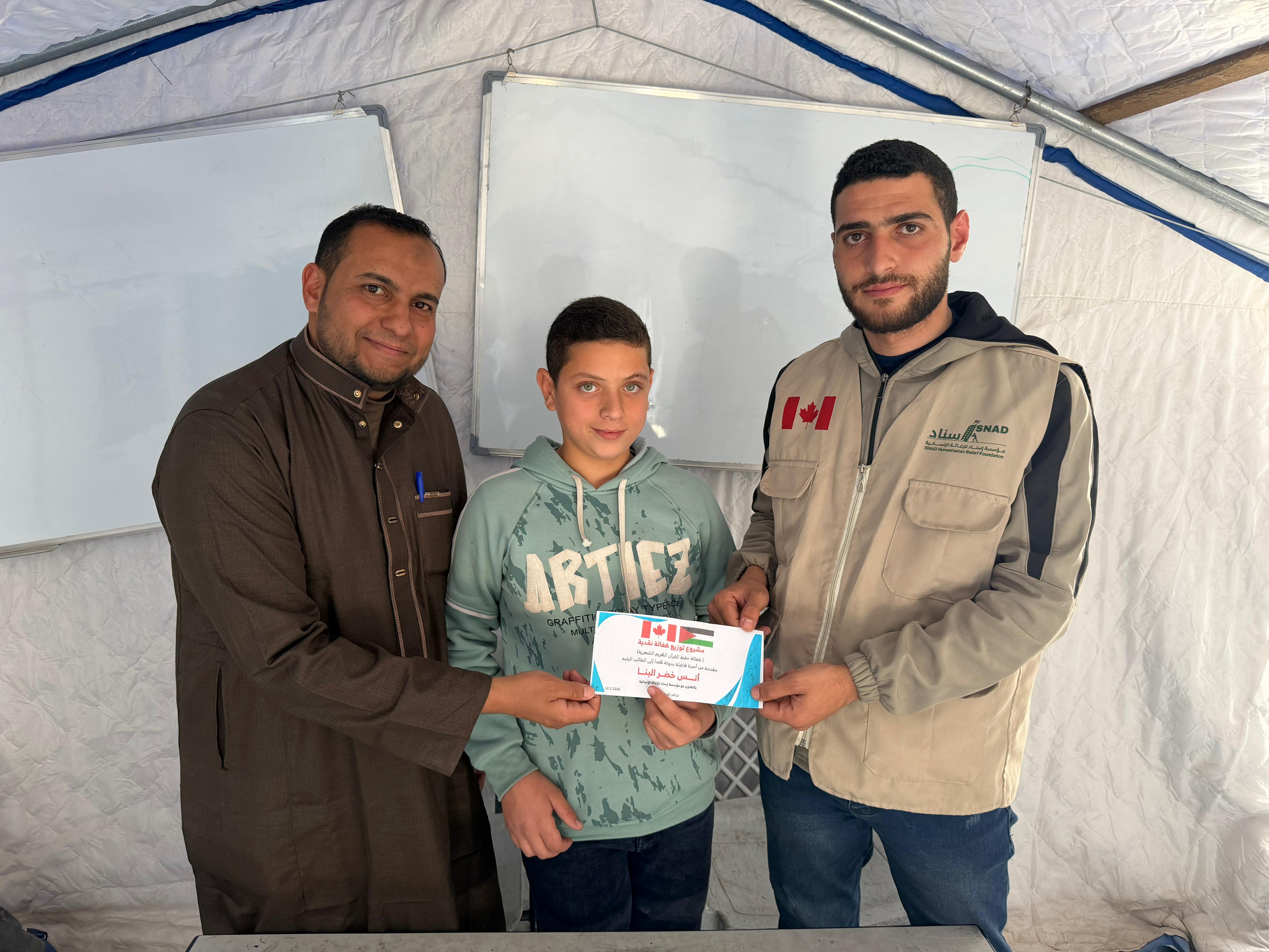 Isnad team presenting educational certificate to a student